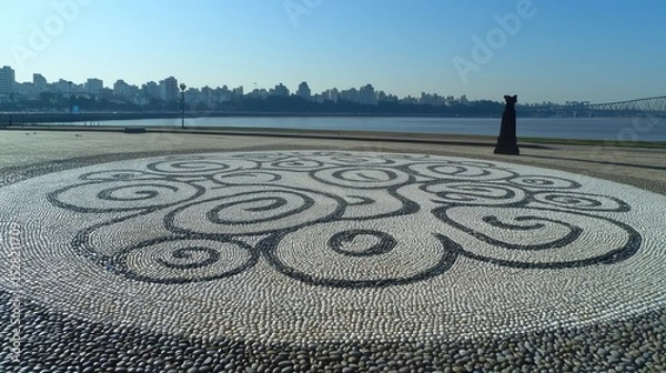 Obraz Intricate pebble mosaic design on a paved area.