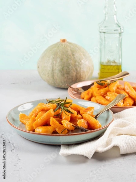 Fototapeta Pumpkin recipe homemade gnocchi on pastel color background