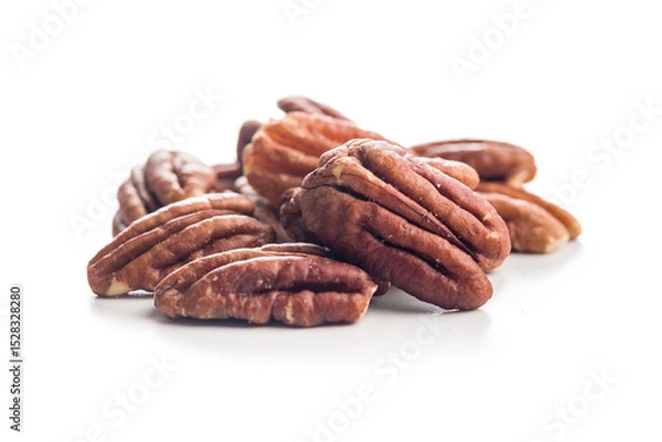 Fototapeta Peeled pecan nuts  isolated on white background.