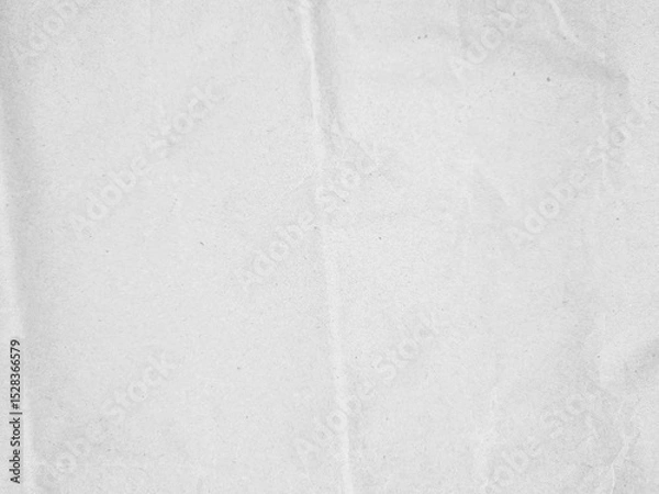 Fototapeta Crumpled textured white paper with subtle folds and creases, perfect for background use in design projects or presentations. The image portrays a natural, slightly wrinkled surface