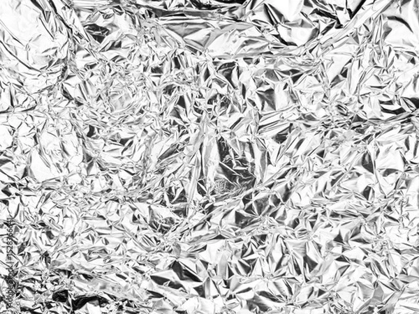 Fototapeta Crinkled reflective surface with intricate creases and folds, showcasing a textured and chaotic pattern. Abstract shapes create a shimmering effect across the entire expanse