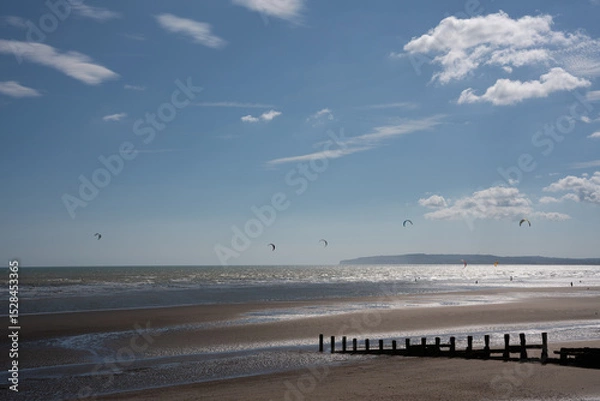 Obraz pier on the beach with windsurfers