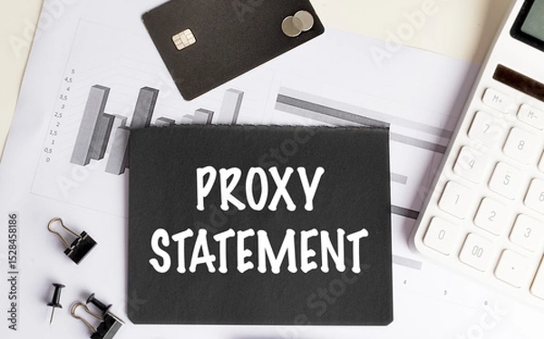 Fototapeta Proxy statement text on black paper with charts, credit card, calculator and office supplies
