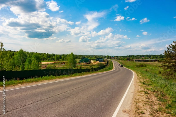 Fototapeta Road going into the distance in the rural hinterland