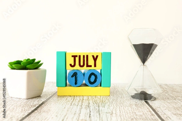 Fototapeta Vintage photo, July 10th. Date of 10 July on wooden cube calendar