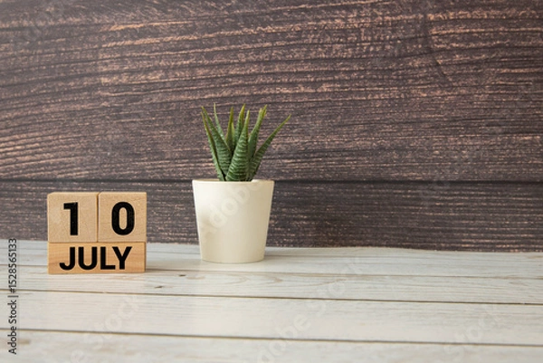 Fototapeta Vintage photo, July 10th. Date of 10 July on wooden cube calendar