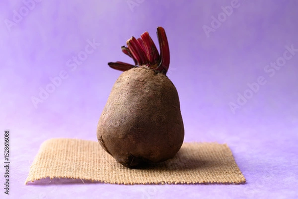 Obraz Fresh beetroot on purple background, Imperfectly shape