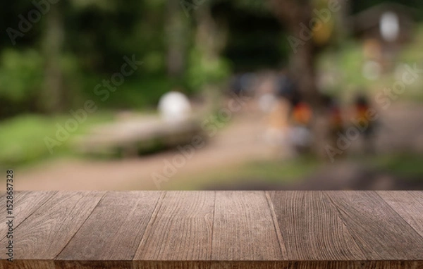 Fototapeta Empty wood table top and blur of restaurant background selective focus product display