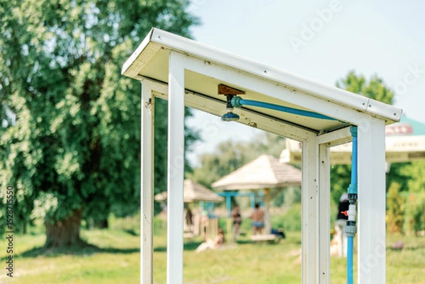 Fototapeta Close-up of beach shower frame with plumbing