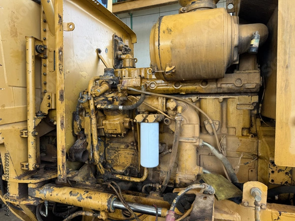 Fototapeta Mechanical Marvel A detailed, close-up shot unveils the complex inner workings of an industrial machine, with intricate components. Showing the impressive machinery and the expertise behind it.