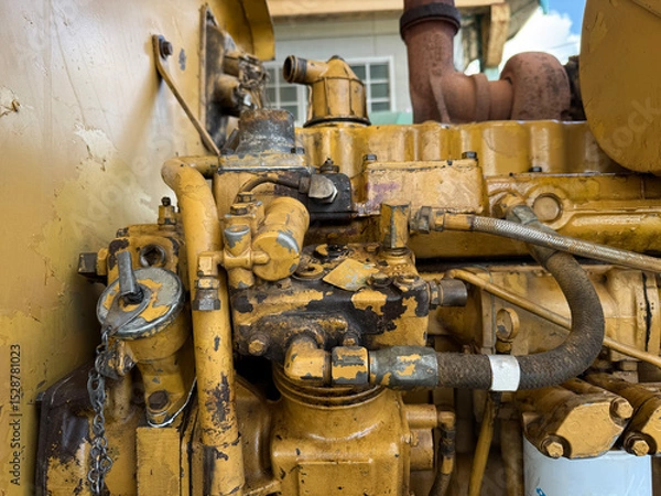 Fototapeta Industrial machinery A close-up shot of a complex industrial engine, highlighting intricate details and the robust design, perfect for illustrating the power and precision of machinery.
