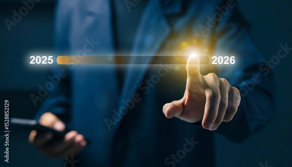 Fototapeta Businessman touching a digital timeline transitioning from 2025 to 2026, representing future planning, innovation, and strategic growth in business or technology.