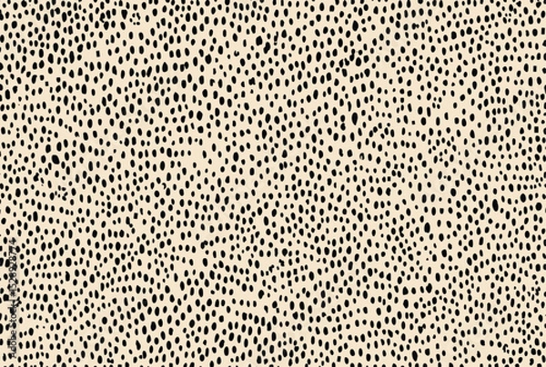 Fototapeta seamless pattern of small dots in light beige and black, arranged to create an abstract cheetah-like texture, perfect for creating animal print wallpaper or fabric designs