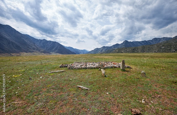 Fototapeta Ancient burials in the Altai mountains on terrace of the Katun and Bolshoy Yaloman rivers.