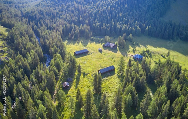 Fototapeta Old wooden border outpost cordon near Altai river Upper Kulash. Camera looks down.
