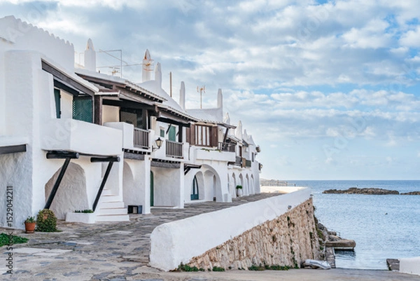 Fototapeta Iconic White Mediterranean Architecture Of Binibeca Vell Village Overlooking The Sea. Menorcan Coastal Town, Balearic Islands Travel, Whitewashed Houses