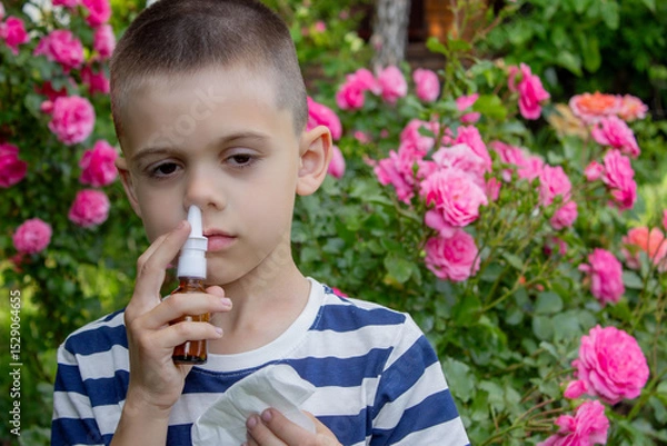 Fototapeta Child Sneezing from Flower Allergy. Selective focus