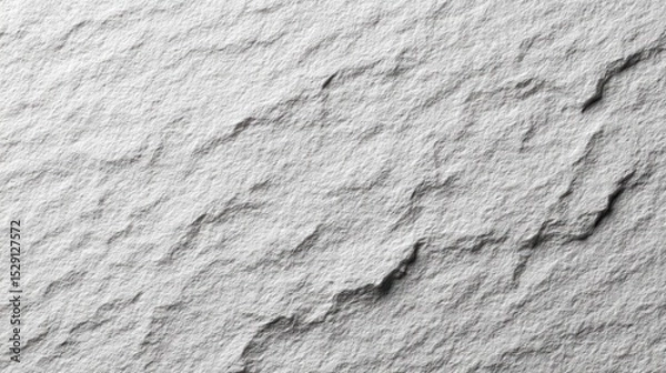 Fototapeta Close-up of a textured gray rock surface with natural patterns and shadows.