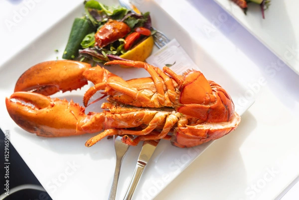 Obraz Family with children, having lunch in a restaurant in Coppenhagen, eating local fish and lobster thermidor with salad and fries