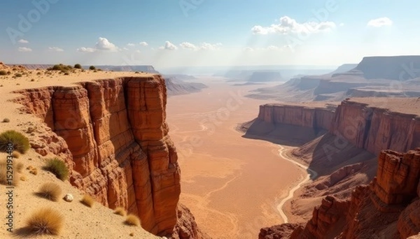 Fototapeta Dramatic Masada clifftop view, desert expanse below , cliff, rocks, sunlight