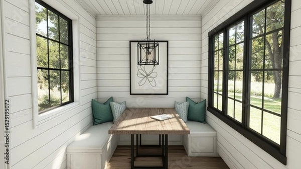 Fototapeta Modern farmhouse dining nook with white oak flooring, black windows, light blue-green pillows, square wood table, white shiplap walls, and willow pendant chandelier