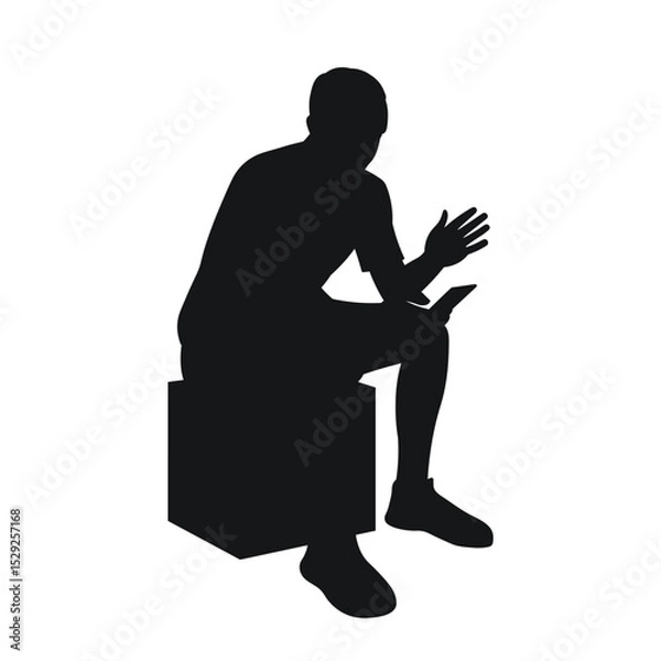 Fototapeta Man sitting on pouf, reading on phone, gesturing with hands, black silhouette