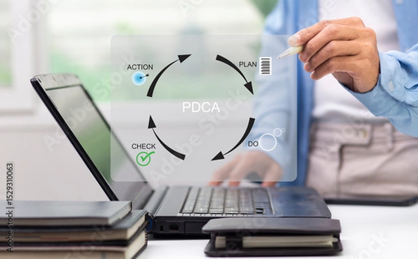 Fototapeta Businessman writing graph diagram PDCA, Plan, Do, Check, Action at workplace in office,  continuous improvement process concept