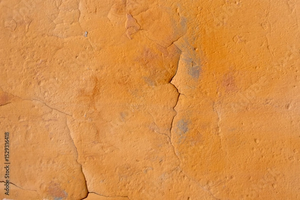 Obraz Orange plaster with cracks on an old wall