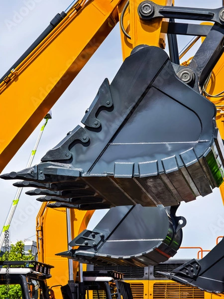 Obraz Excavator bucket close-up showcased during construction in an industrial site