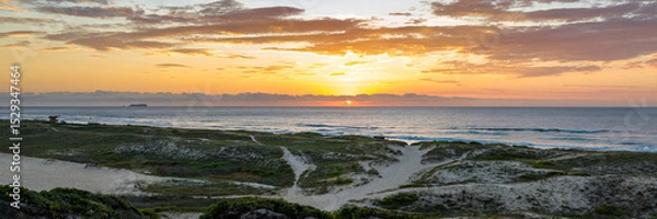 Fototapeta Florianópolis, Campeche beach during sunrise. Brazil. Rio Tavares neighborhood in web banner during sunrise. Aerial view in web banner.