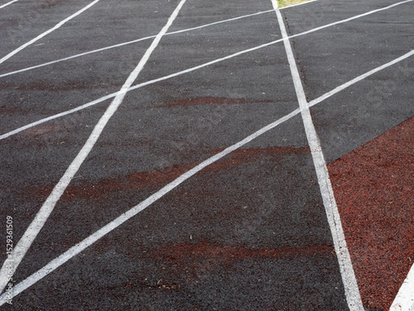 Fototapeta A track with white lines and a red line