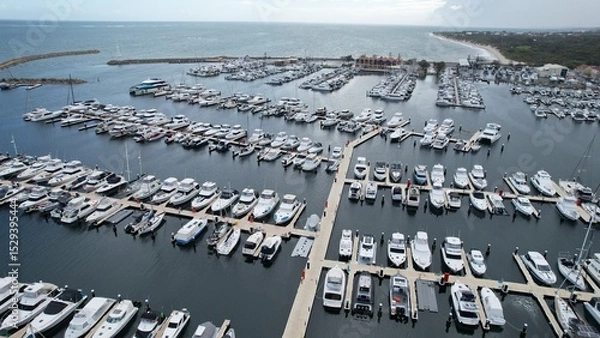 Fototapeta Hillarys, Australia – June 3, 2025: Aerial View of The Hillarys Boat Harbour of Perth CBD