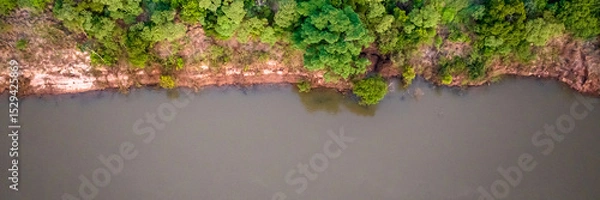 Fototapeta Border between Brazil and Paraguay and connects Foz do Iguacu to Ciudad del Este. Ponte da Amizade in Foz do Iguacu. Aerial view of the Friendship Bridge with Parana river. Square image.
