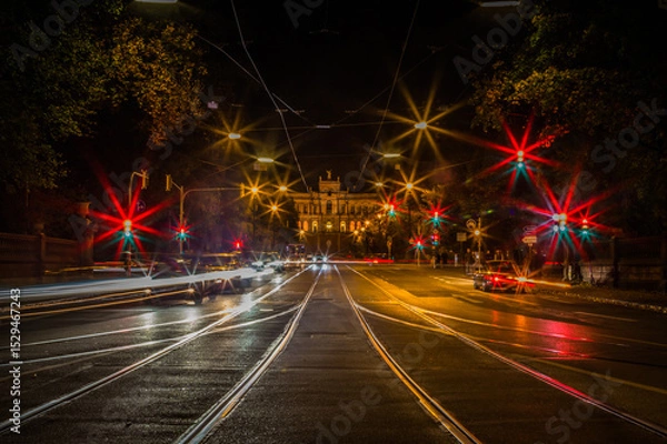 Fototapeta Lights of the night traffic in city of Munich, view towards the Maximilianeum, seat of the Bavarian government in Munich