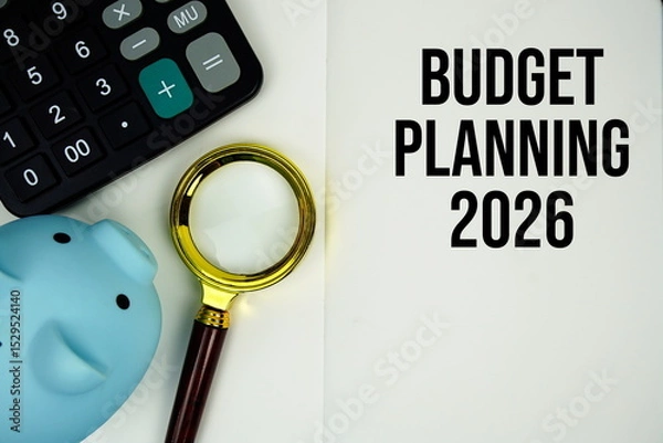 Fototapeta Budget Planning 2026 text on note page with calculator, piggy bank and magnifying glass