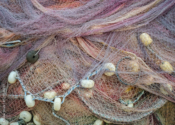 Fototapeta Pile of fisher nets, abstract pattern for design or decor element of fishery produce or catch equipment. Neap of fishing nets for your texture background, close-up view.