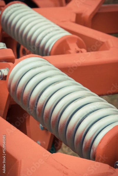 Obraz Silver hard spring made of steel. Part of big industrial or agricultural machine