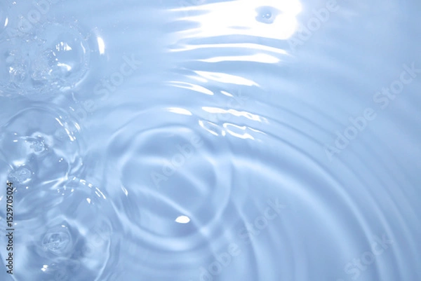 Fototapeta Calm Water Surface with Gentle Ripples and Bubbles Formations