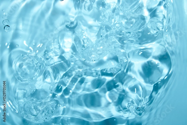 Fototapeta Crystal Clear Blue Water Ripples and Bubbles in Calm Surface