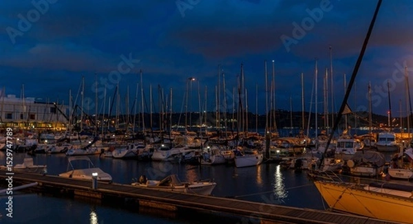 Obraz Panoramic photo of yachts in a marina on the banks of the Tagus in Lisbon at night