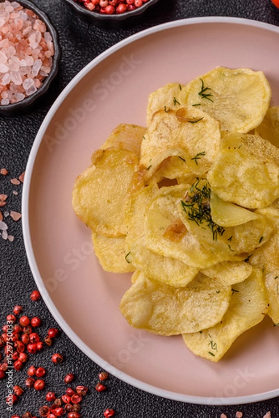 Obraz Crisps fried with salt, spices and garlic. Cooked potatoes