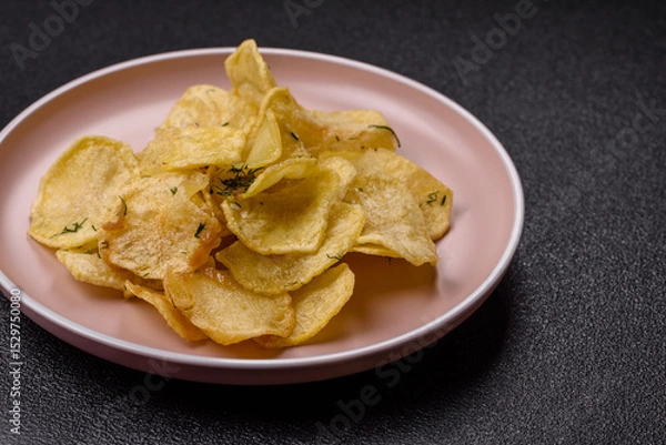 Obraz Crisps fried with salt, spices and garlic. Cooked potatoes