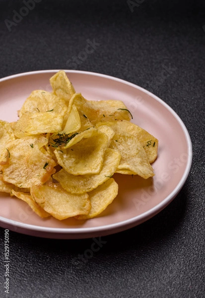 Obraz Crisps fried with salt, spices and garlic. Cooked potatoes
