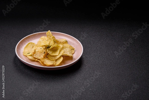 Obraz Crisps fried with salt, spices and garlic. Cooked potatoes