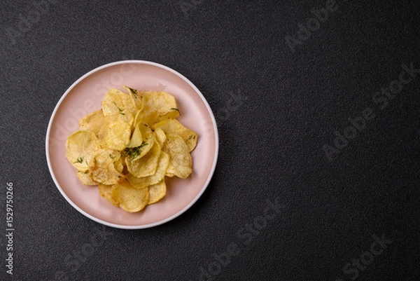 Obraz Crisps fried with salt, spices and garlic. Cooked potatoes