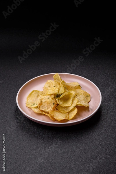Obraz Crisps fried with salt, spices and garlic. Cooked potatoes