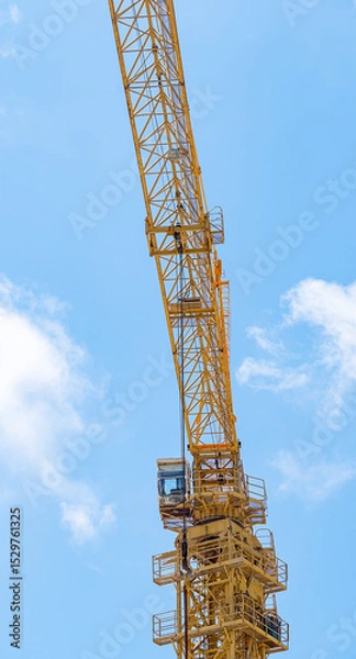 Fototapeta part of yellow construction crane