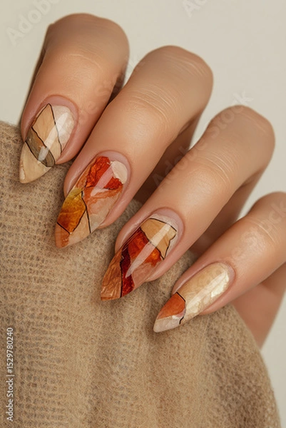 Obraz Abstract nail art in autumn tones: Hand with pointed nails and geometric design in warm and neutral colors, perfect for expressing creativity and style. Ideal for beauty themes, manicure trends and ar