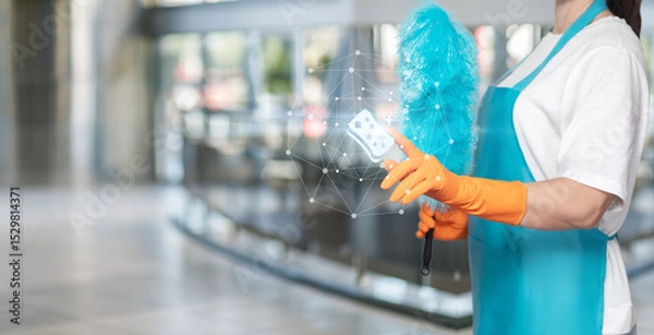 Fototapeta Pro cleaner uses modern tools in lobby.