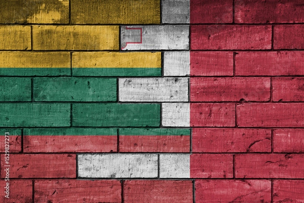 Fototapeta colourful painted big national flag of malta and flag of lithuania on a massive old brick wall background. concept